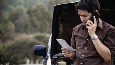 accident- man trying to fix car engine issue